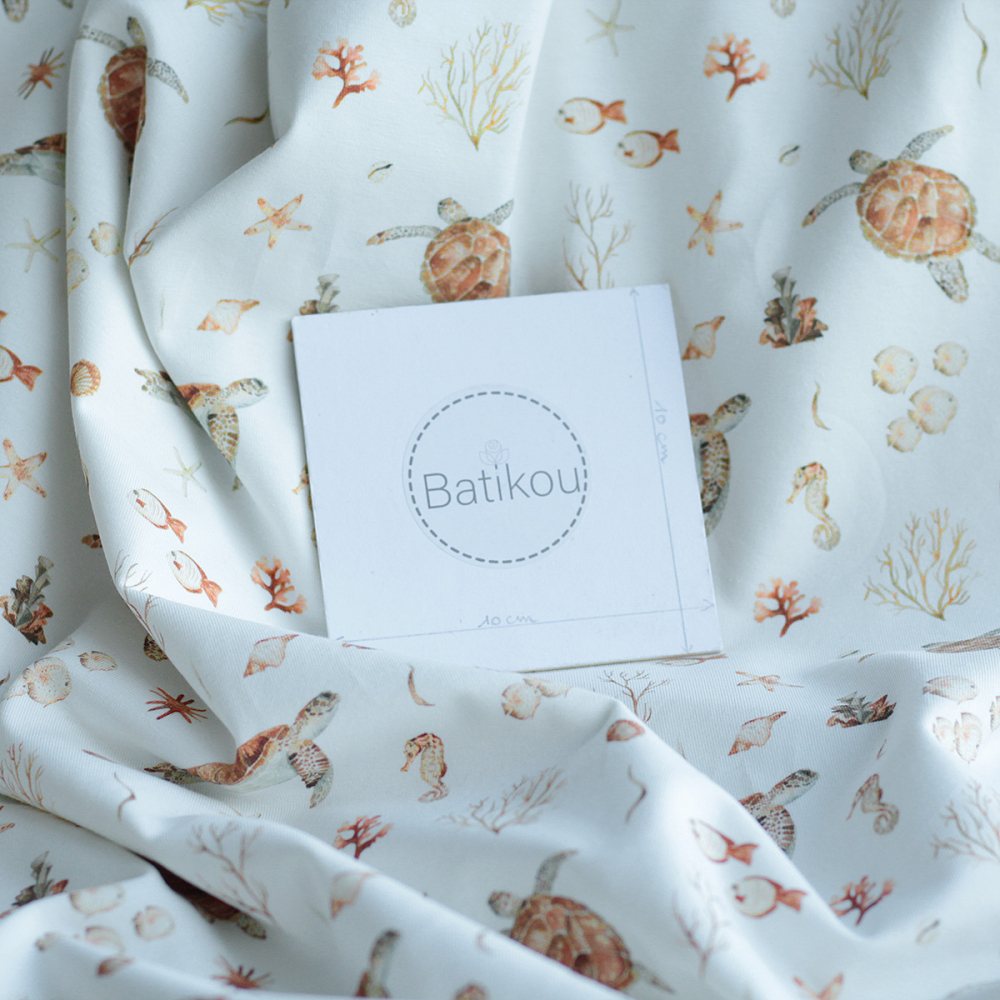 Jersey coton à motifs tortues ocre