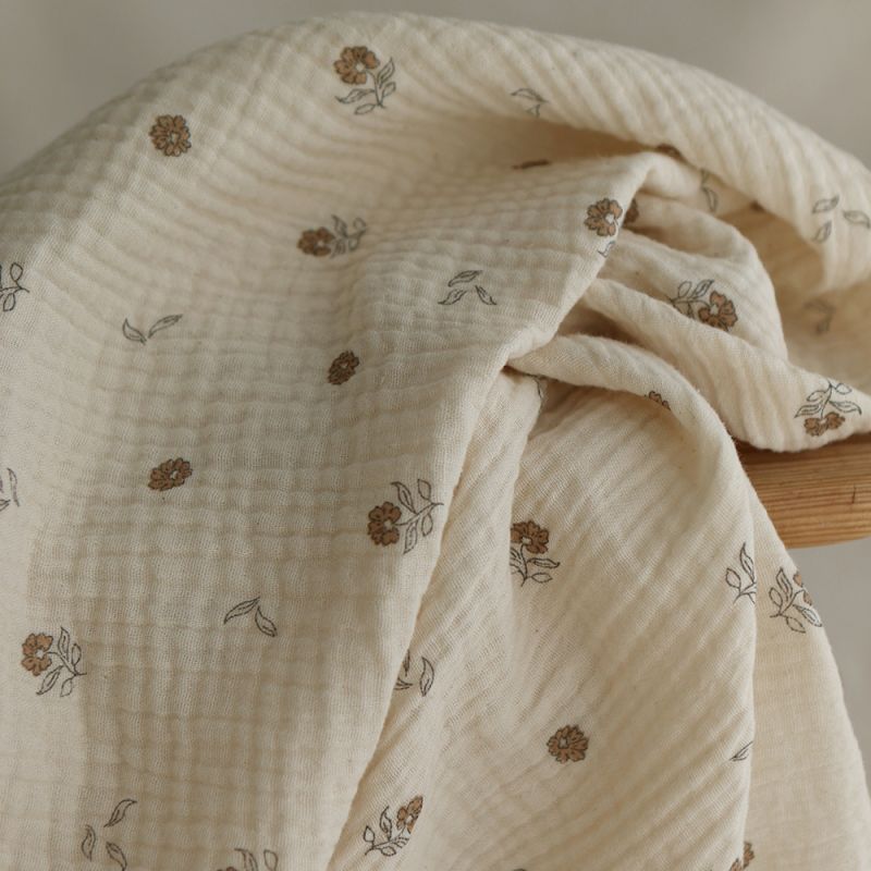 Aïna - Double gaze coton BIO motif fond écru camel Aïna - Double gaze coton BIO motif fond écru camel