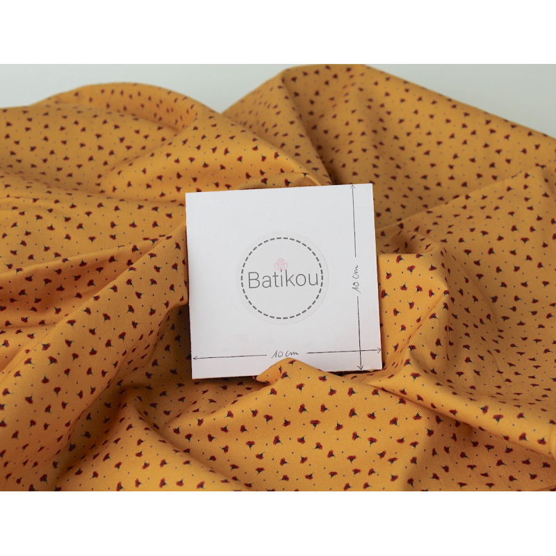 Tissu sergé / twill de coton organique imprimé fond moutarde x1m Tissu sergé / twill de coton organique imprimé fond moutarde x1m