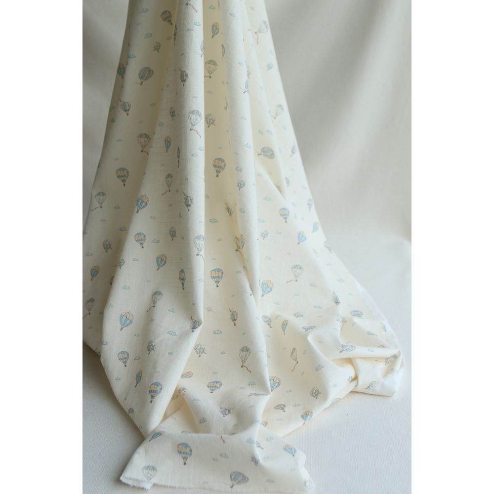 Fergusson - Coton lavé bio coloris vanille motif montgolfière Fergusson - Coton lavé bio coloris vanille motif montgolfière