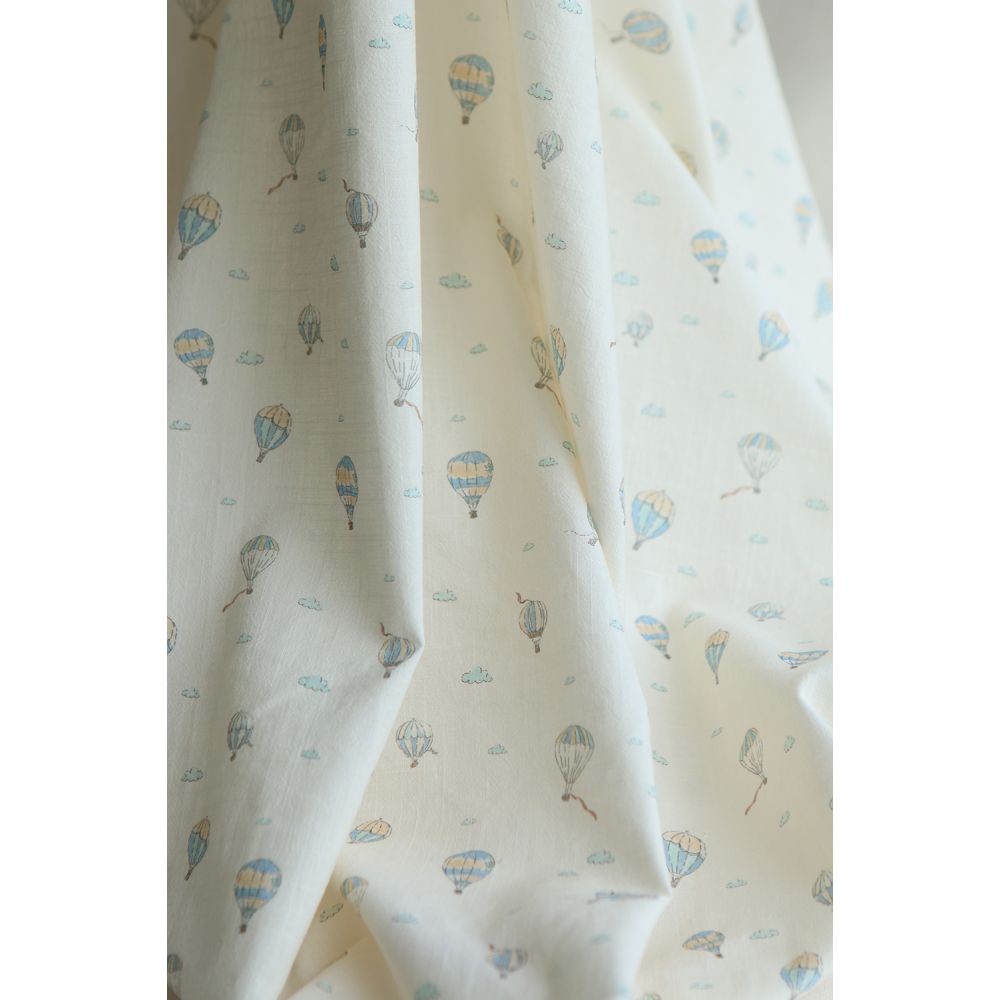 Fergusson - Coton lavé bio coloris vanille motif montgolfière Fergusson - Coton lavé bio coloris vanille motif montgolfière