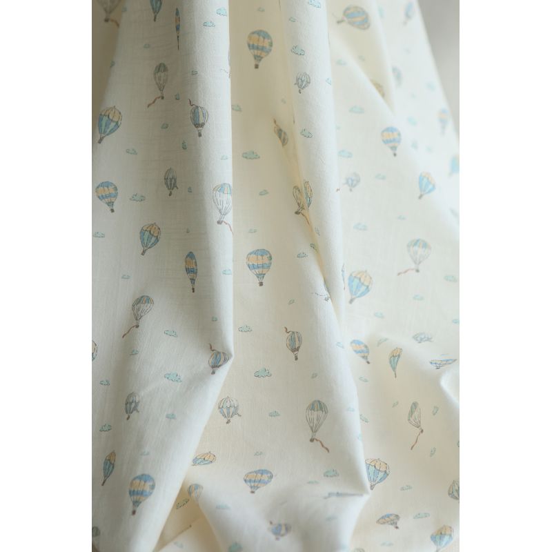 Fergusson - Coton lavé bio coloris vanille motif montgolfière Fergusson - Coton lavé bio coloris vanille motif montgolfière