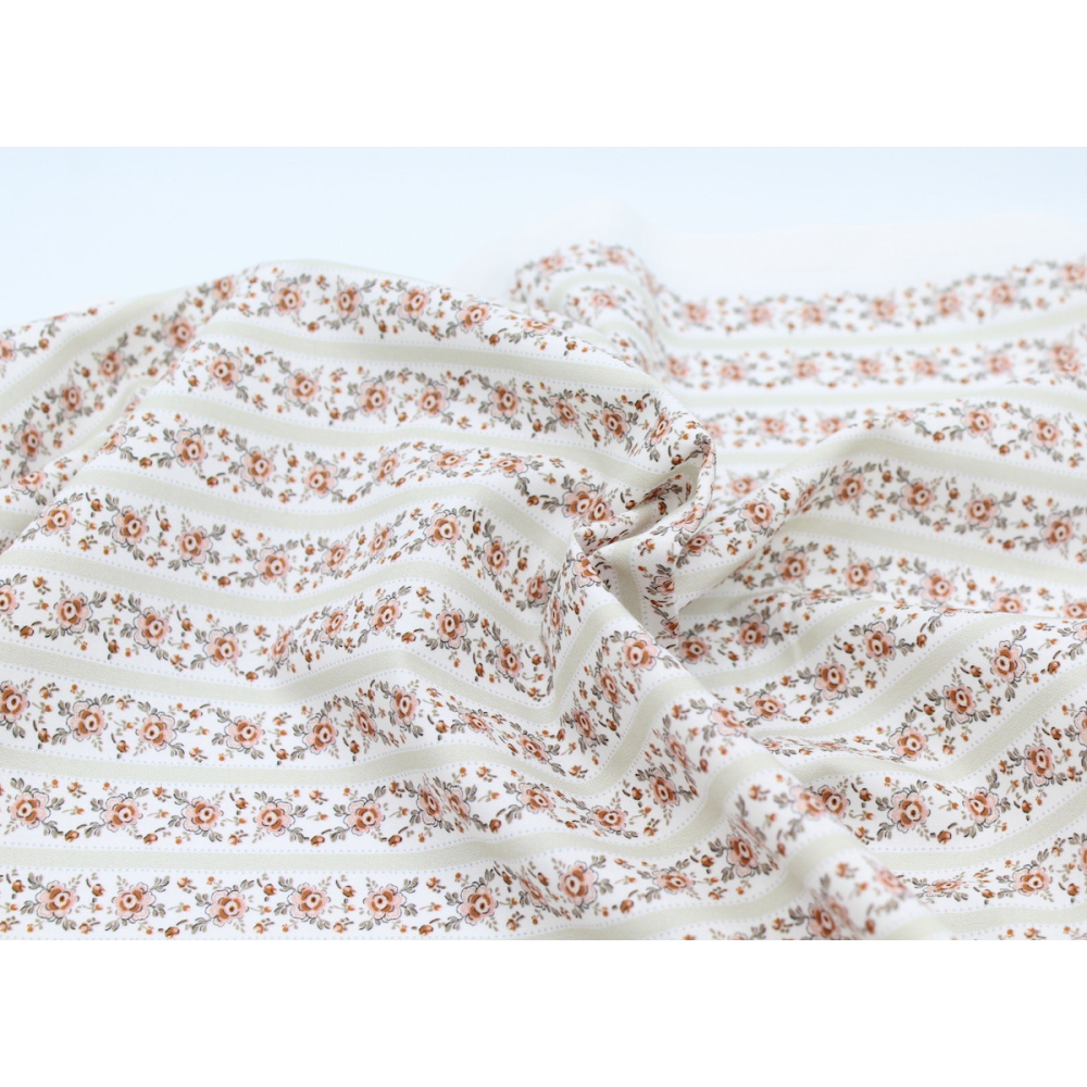 Popeline de coton imprimé fleuri vert tendre