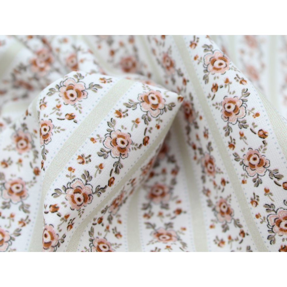 Popeline de coton imprimé fleuri vert tendre