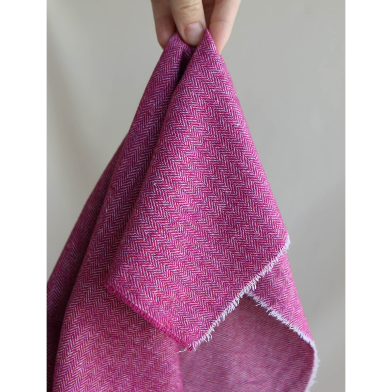 Tissu chevrons texturé coton / laine coloris framboise
