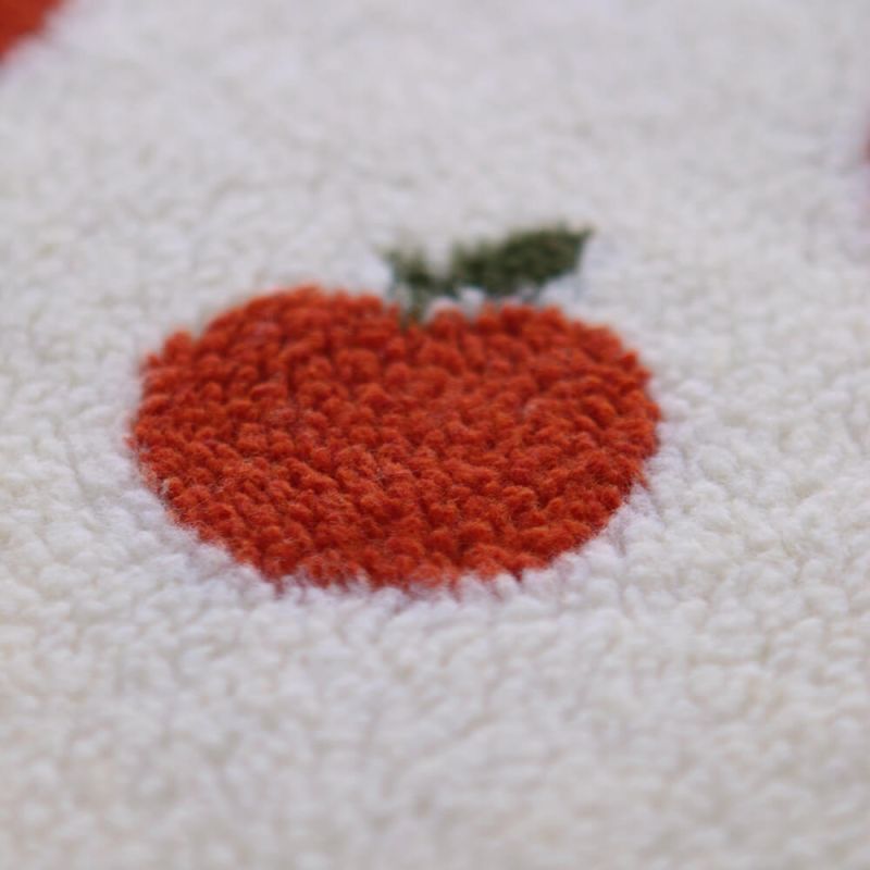 Teddy / moumoute bouclé fond écru motif pommes