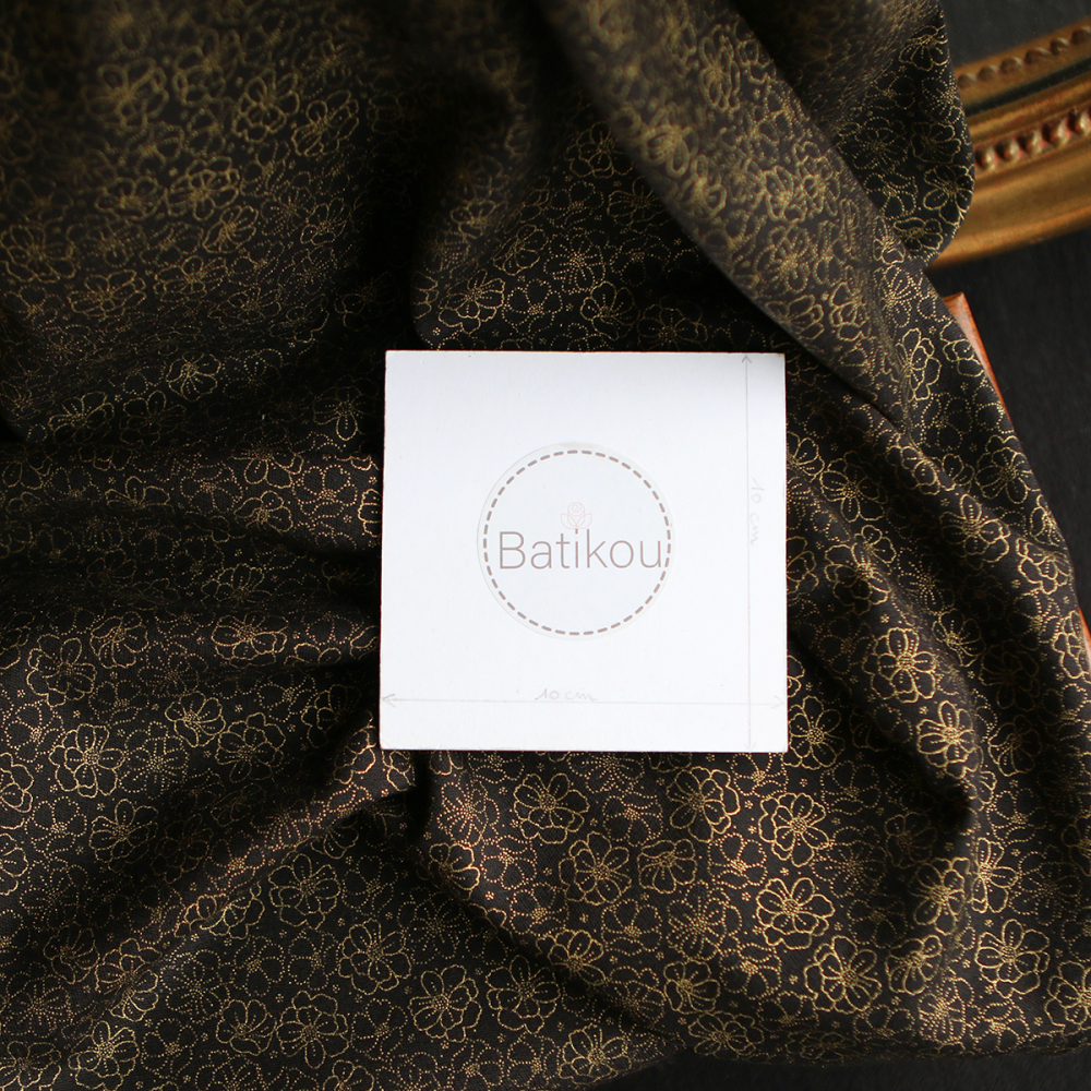 Coton viscose motif doré fond noir