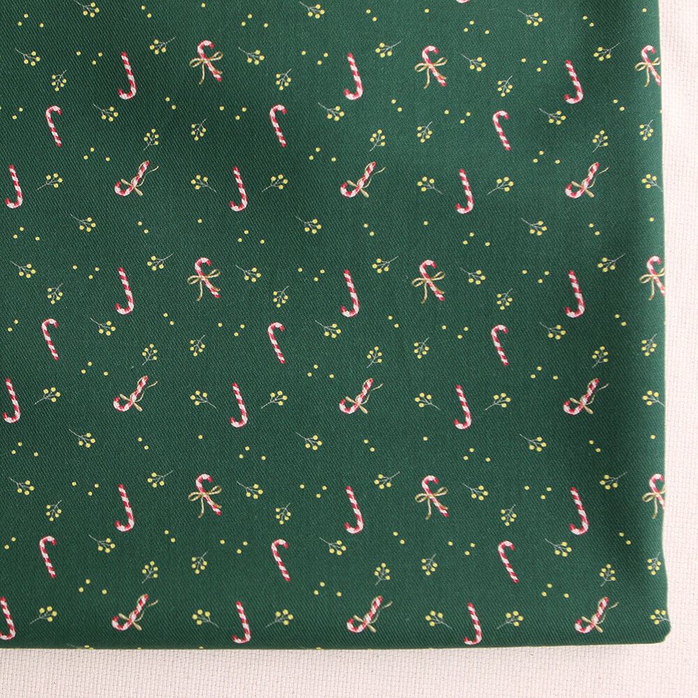 Tissu sergé de coton organique fond vert imprimé cannes à sucre