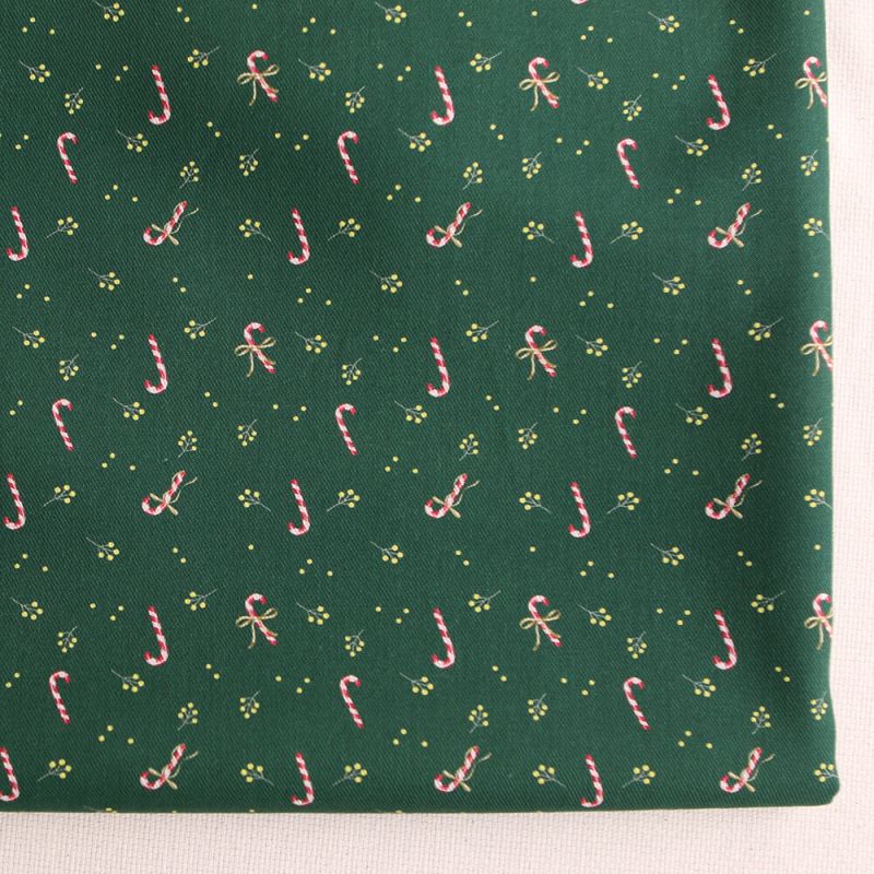 Tissu sergé de coton organique fond vert imprimé cannes à sucre