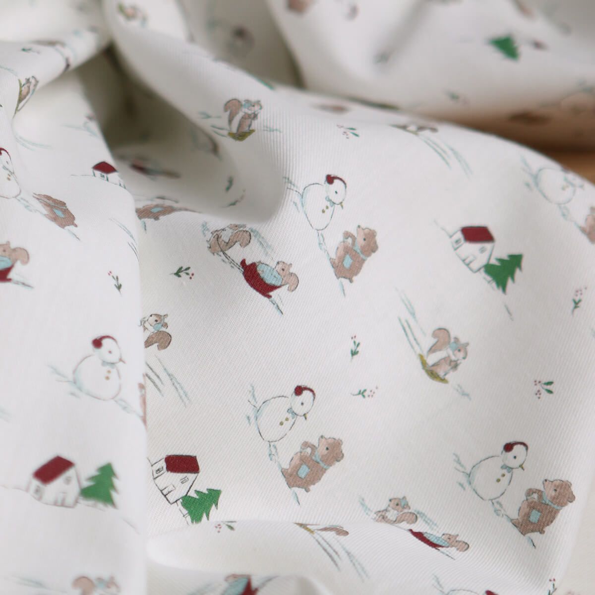 Tissu sergé de coton organique imprimé personnages d'hiver
