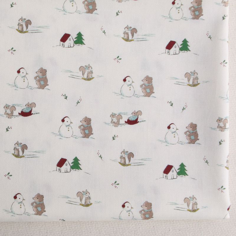 Tissu sergé de coton organique imprimé personnages d'hiver