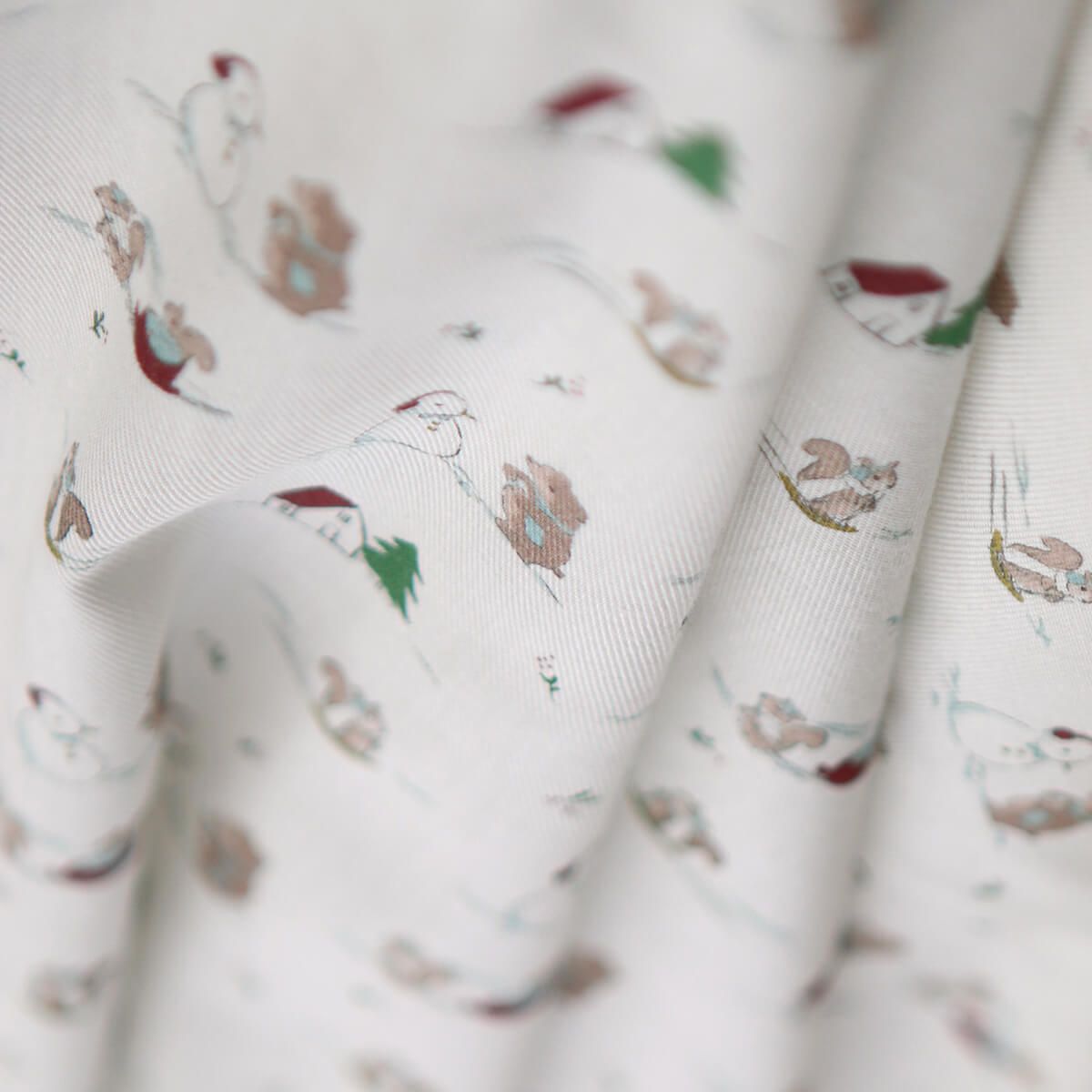 Tissu sergé de coton organique imprimé personnages d'hiver