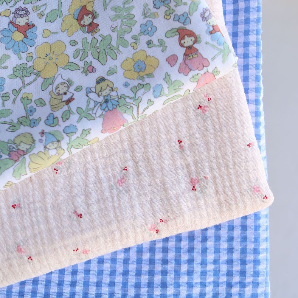 Leonie - Double gaze de coton motif fond rose tendre motif petit fleuri