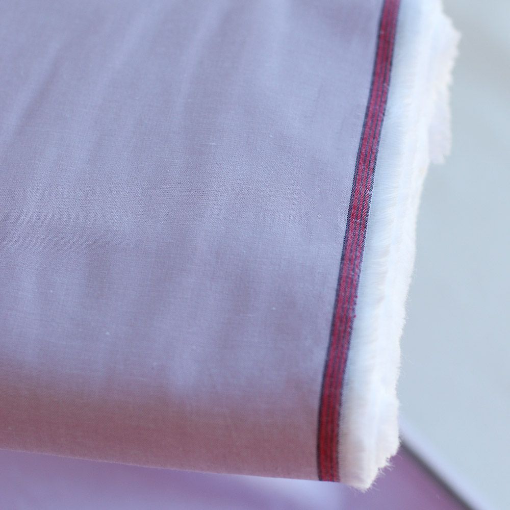 Popeline coton uni chiné effet chambray parme