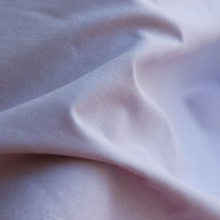 Popeline coton uni chiné effet chambray parme