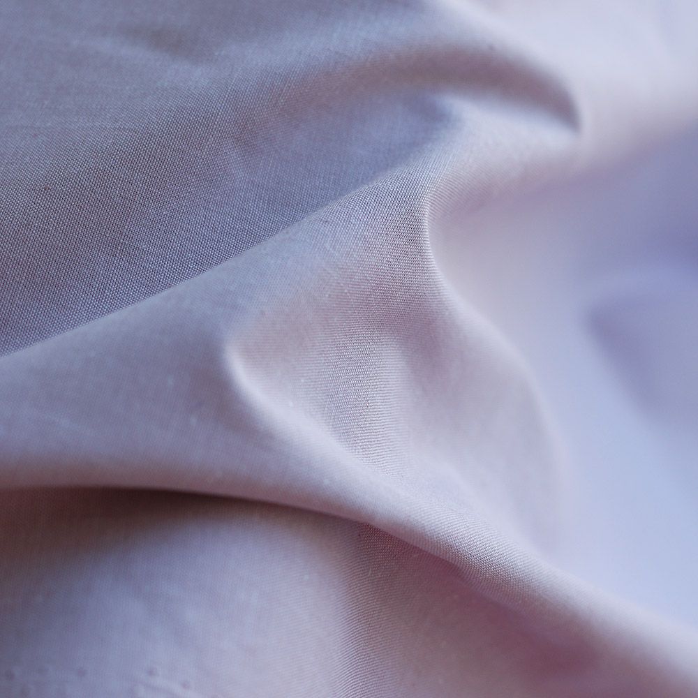 Popeline coton uni chiné effet chambray parme