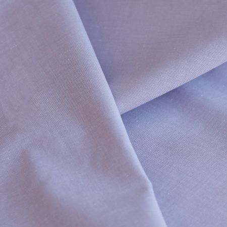 Popeline coton uni chiné effet chambray parme