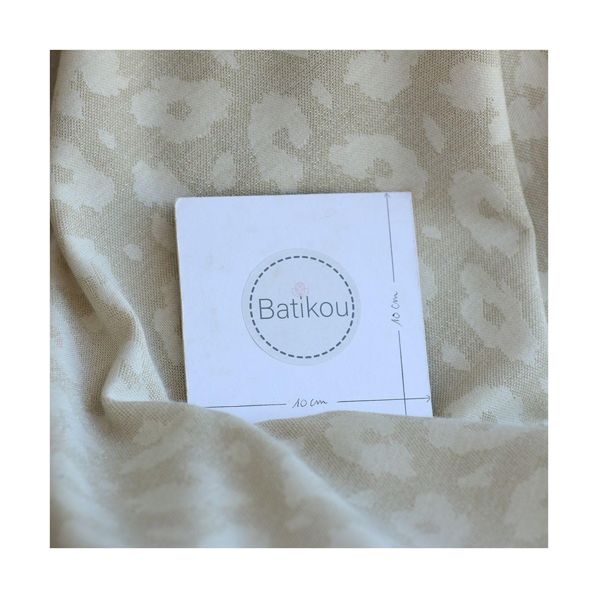 Jersey jacquard à motif graou ton sur ton écru doré