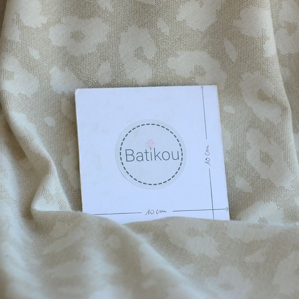 Jersey jacquard à motif graou ton sur ton écru doré