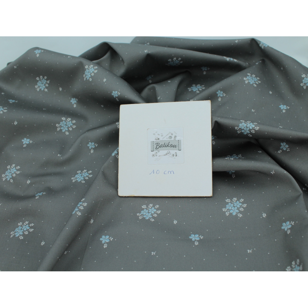 Coton satiné motif Beth exclusif Batikou fond pois gris étain x1m