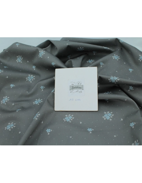 Coton satiné motif Beth exclusif Batikou fond pois gris étain x1m