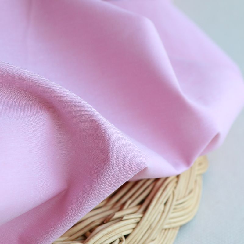 Popeline coton uni chiné effet chambray rose frais