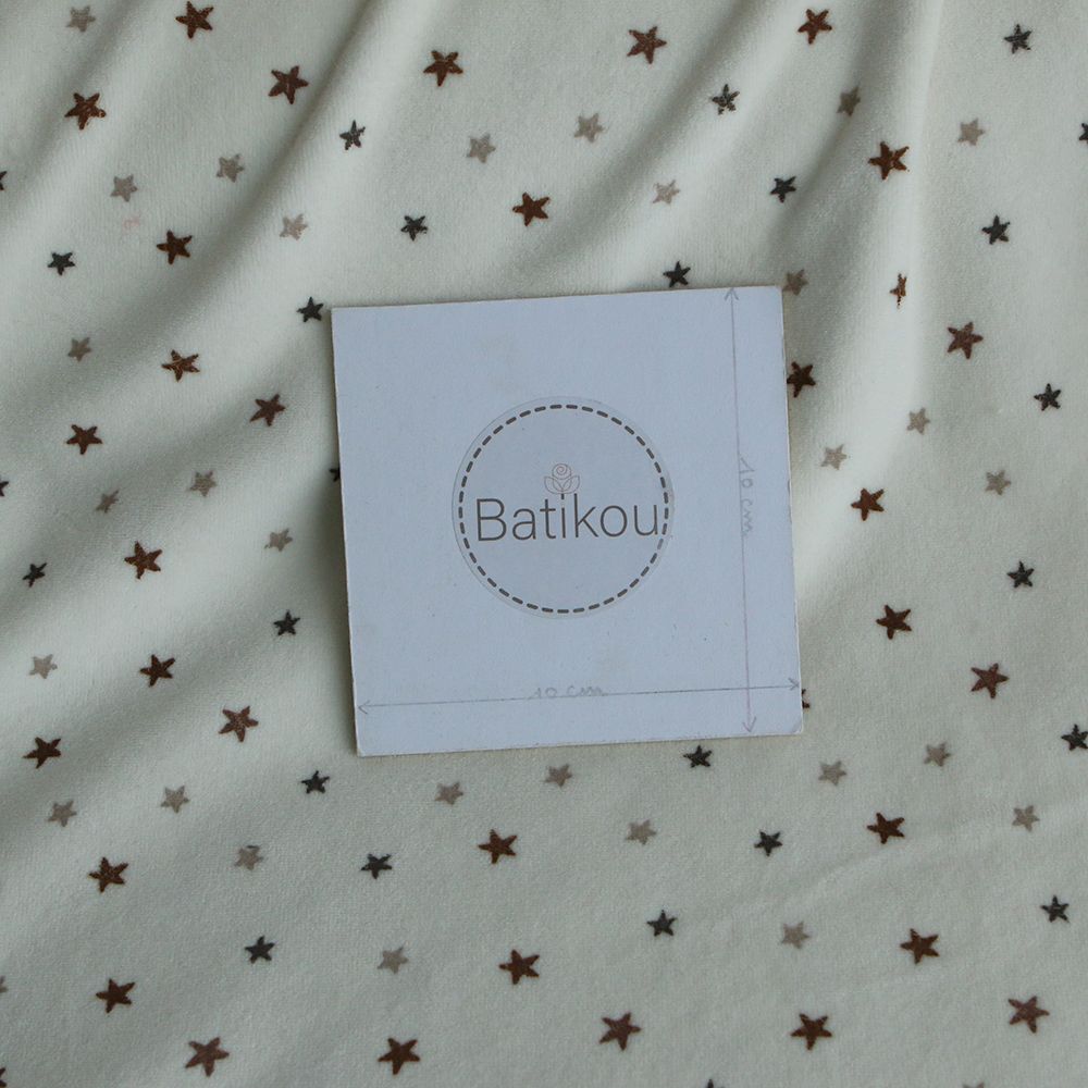 Stars - Velours de coton Nicky fond blanc lait motif étoiles marron