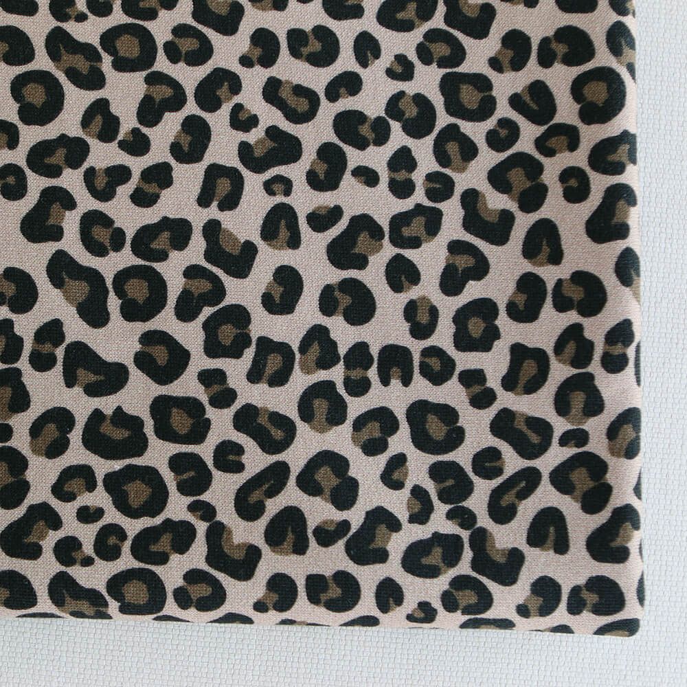 Lea - Tissu sweat graou noir et noisette fond nude