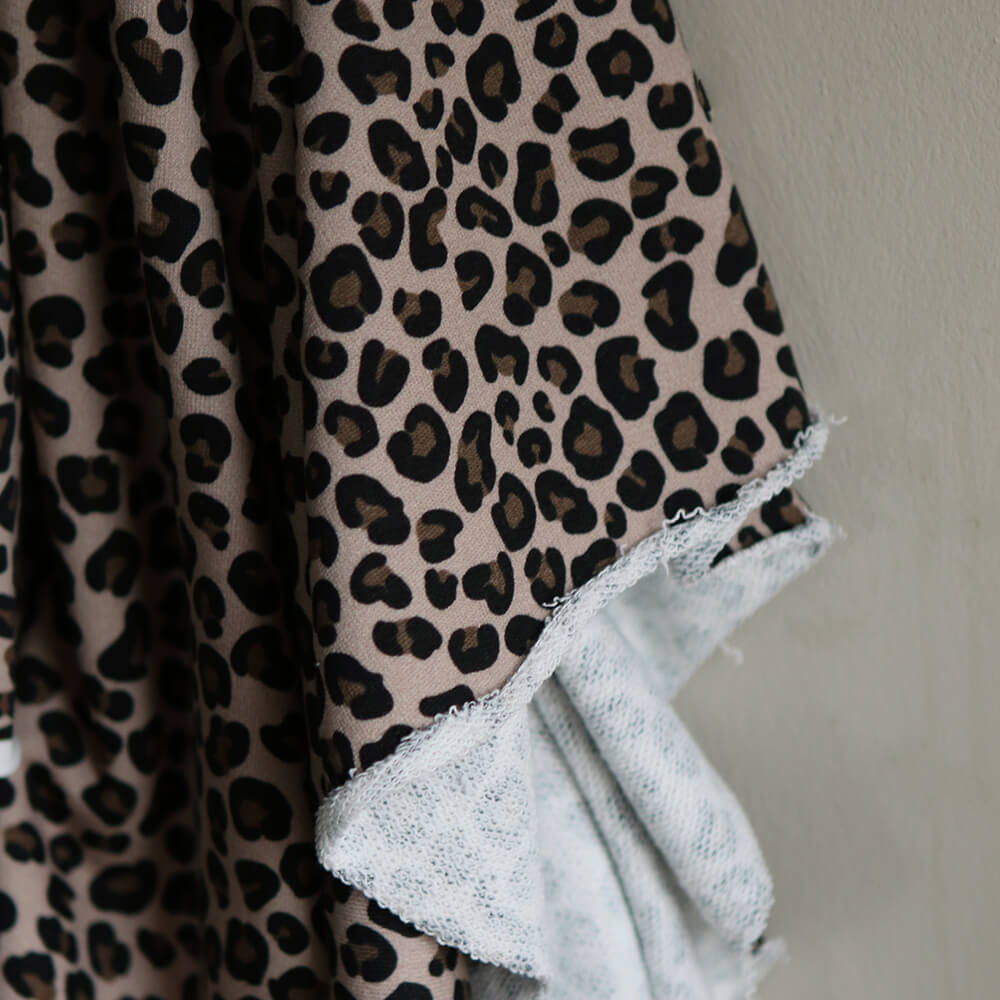 Lea - Tissu sweat graou noir et noisette fond nude