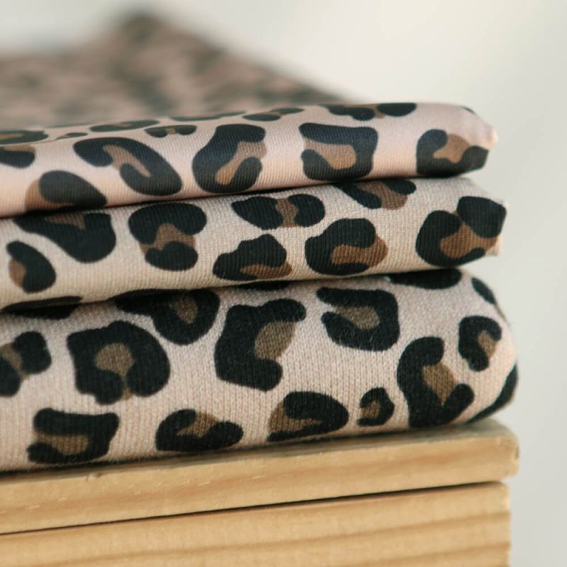 Lea - Tissu sweat graou noir et noisette fond nude