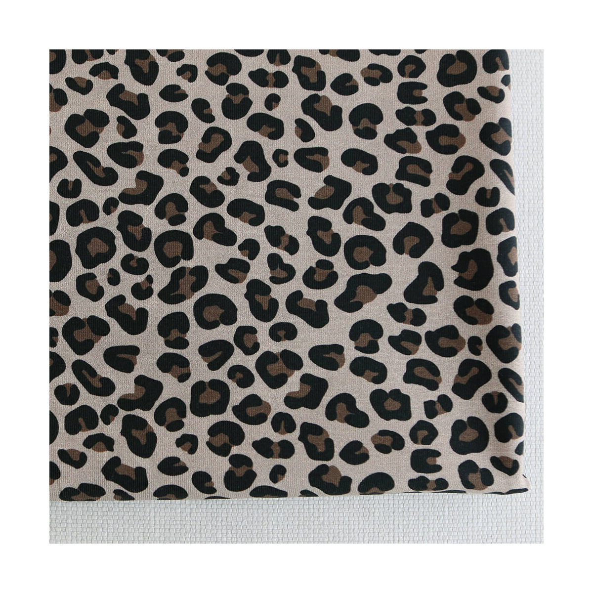 Lea - Jersey coton bio motif exclusif graou noir et brun châtaigne fond beige poudré