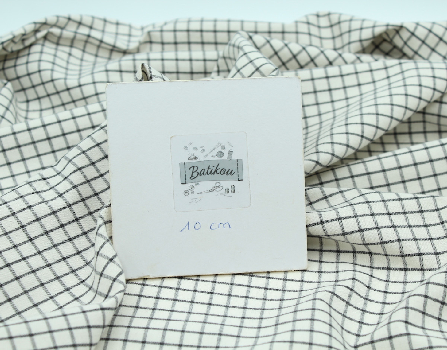 Coton popeline chiné écru carreaux