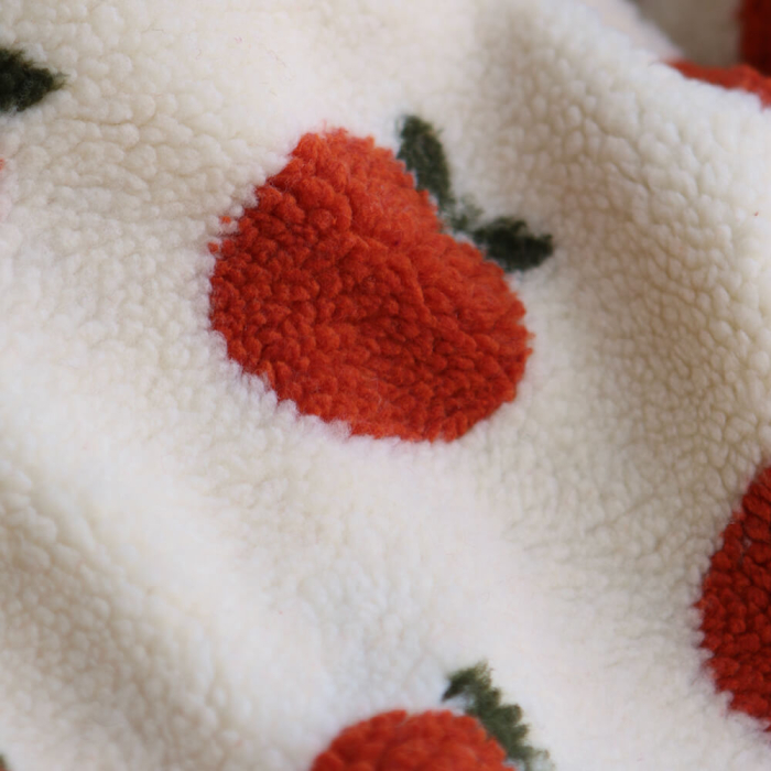 Teddy / moumoute bouclé fond écru motif pommes