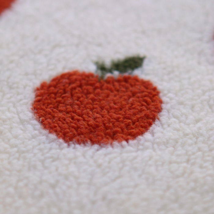 Teddy / moumoute bouclé fond écru motif pommes