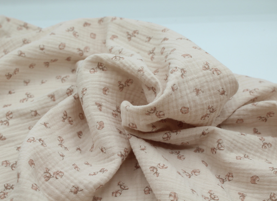 Double gaze de coton coloris nude naturel à motifs fleurs de coton
