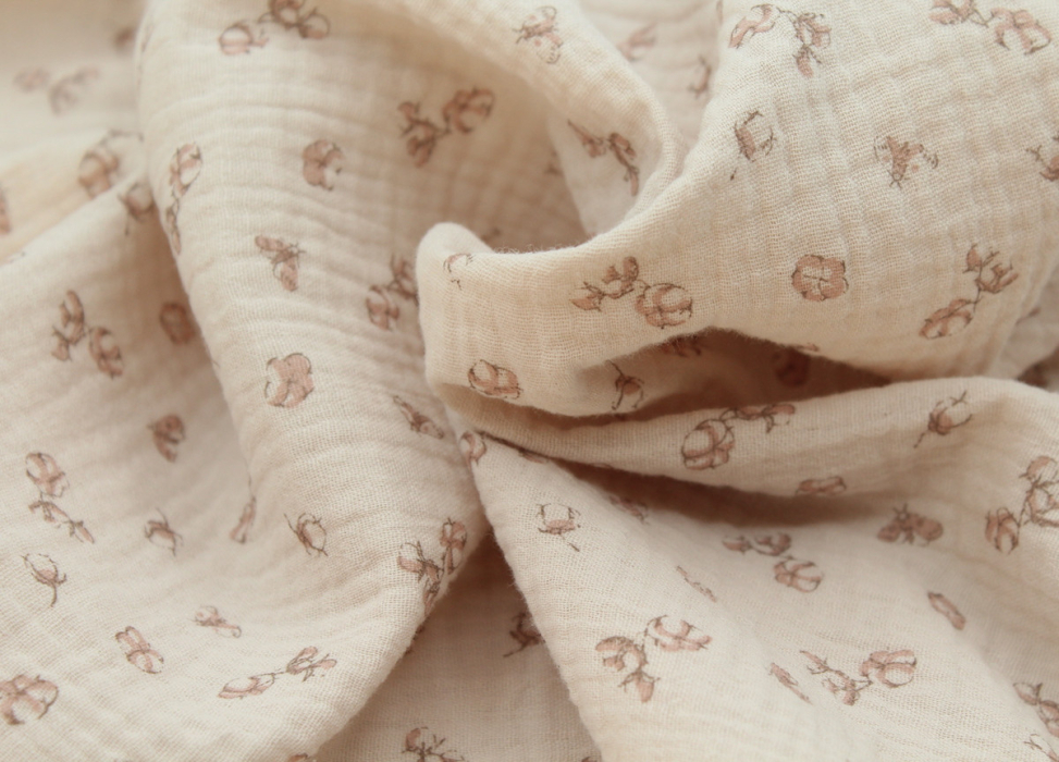 Double gaze de coton coloris nude naturel à motifs fleurs de coton