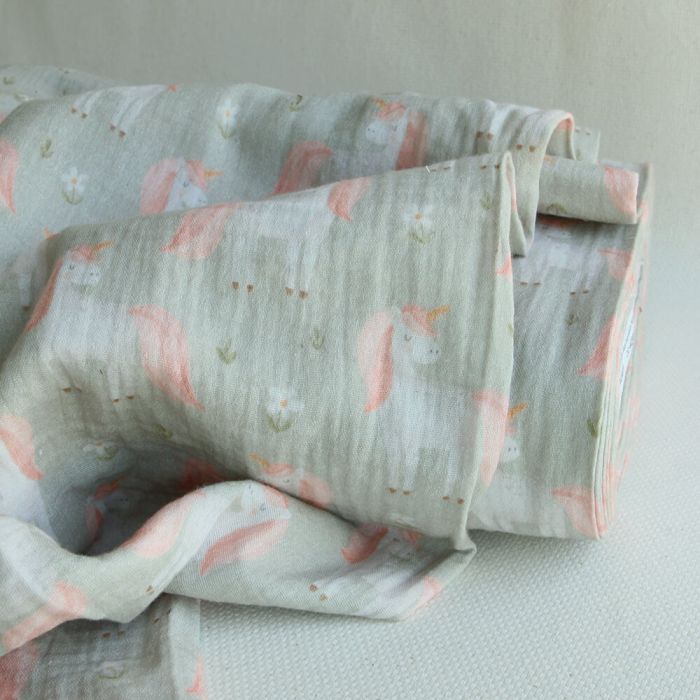 Lilirose - Double gaze de coton fond vert amande tendre imprimé licornes