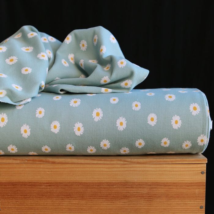 Jersey coton côtes fines à motif marguerites sur fond vert tendre