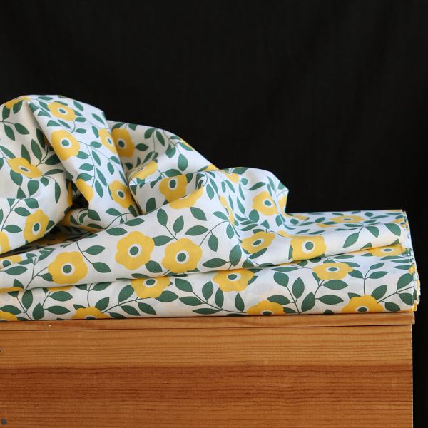 Popeline de coton imprimé fleurs vert et jaune