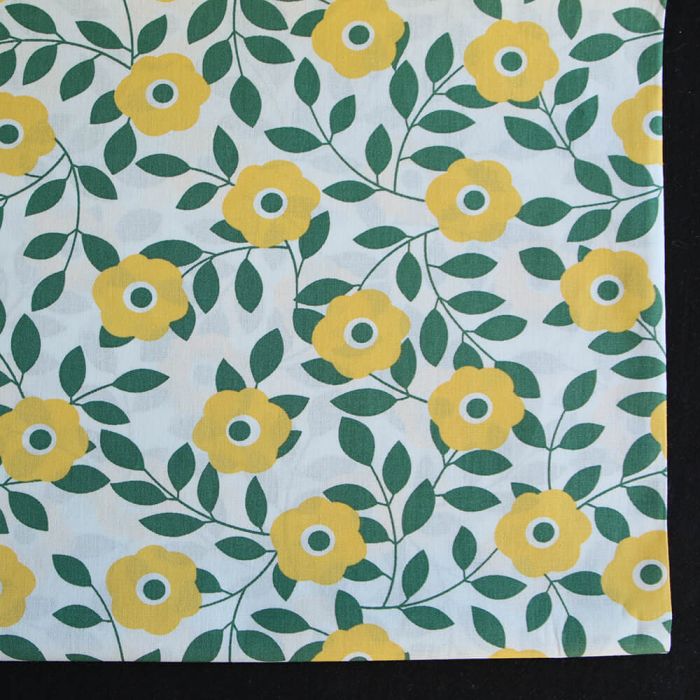 Popeline de coton imprimé fleurs vert et jaune