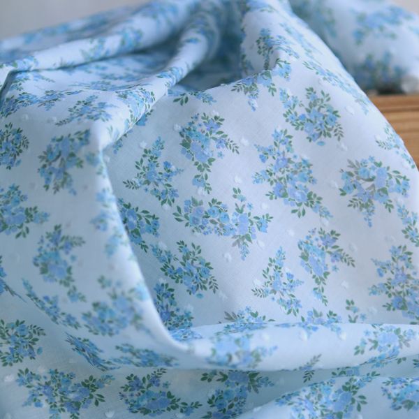 Plumetis de coton BIO petit motif fleuri bleu turquoise