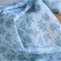 Plumetis de coton BIO petit motif fleuri bleu turquoise