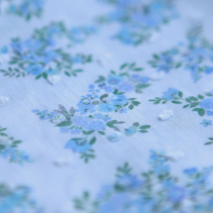 Plumetis de coton BIO petit motif fleuri bleu turquoise