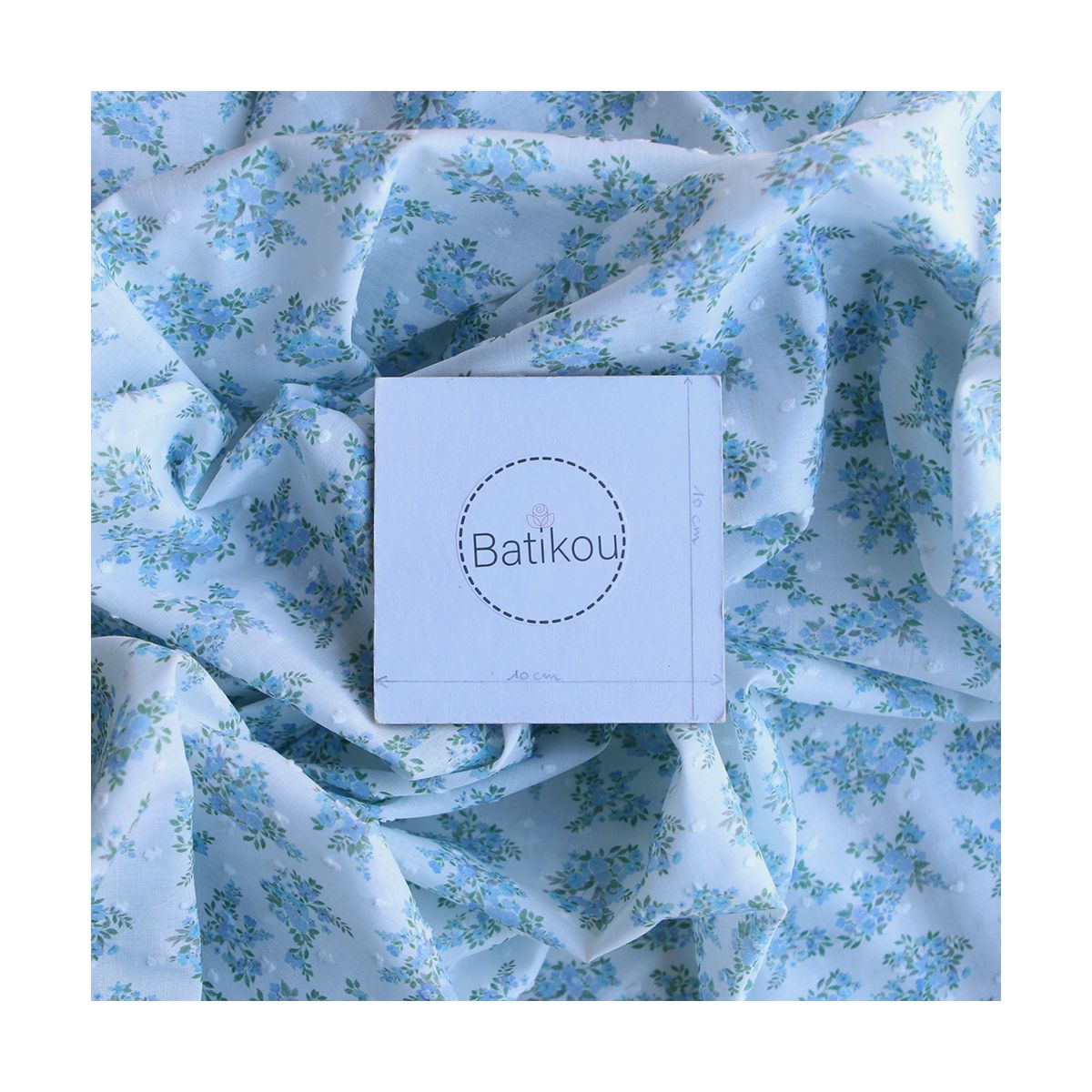 Plumetis de coton BIO petit motif fleuri bleu turquoise