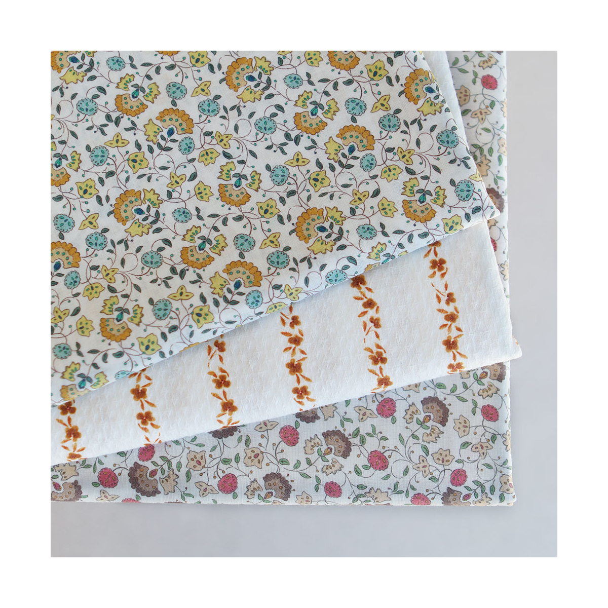 Valentine - Batiste de coton SILKYNE à imprimé fleuri orange et bleu