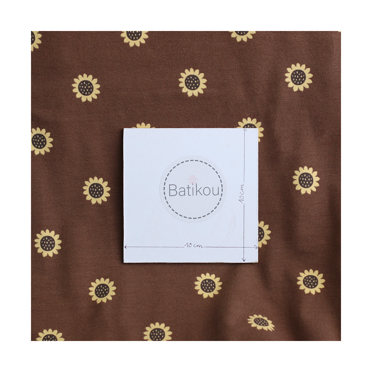 Jersey coton à motif fleurs de tournesol fond chocolat