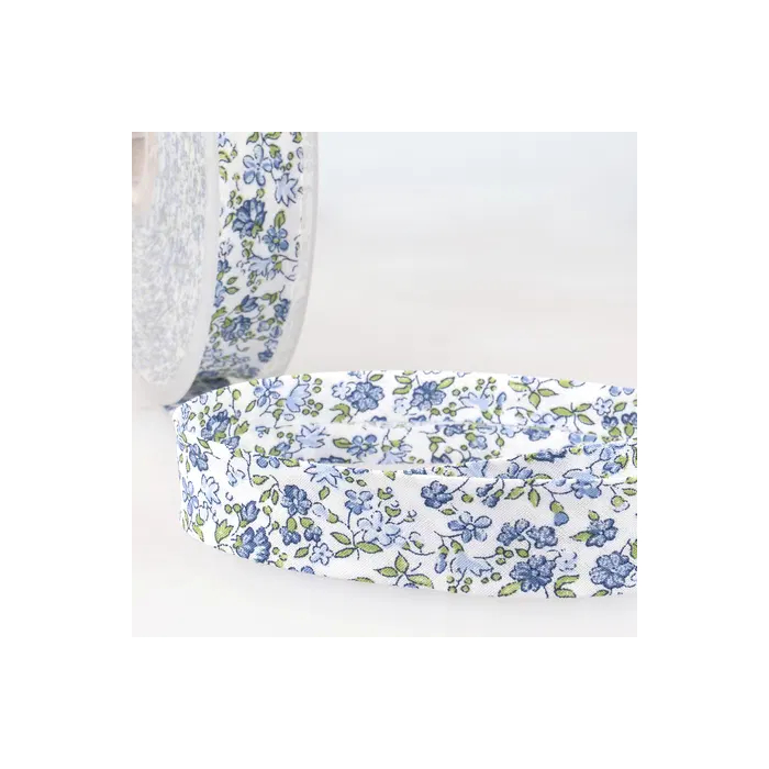 Biais replié fleuri 20 mm coloris bleu, petit semis floral façon liberty sur fond blanc