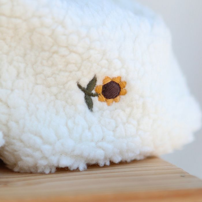Tissu teddy brodé petits tournesols coloris écru