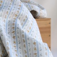Tissu Paloma, petit piqué de coton gratté bio rayures et fleuri beige ocre et bleu poudré