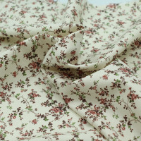 Popeline fine et douce coton organique fond ivoire imprimé fleuri vieux rose